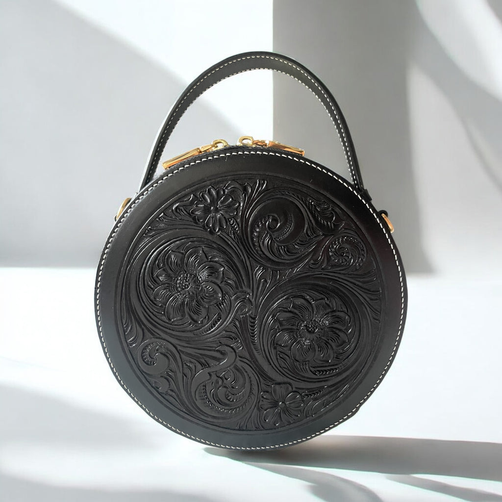 Sac rond Nicky noir en cuir embossé, vue avant – Maison La Reine
