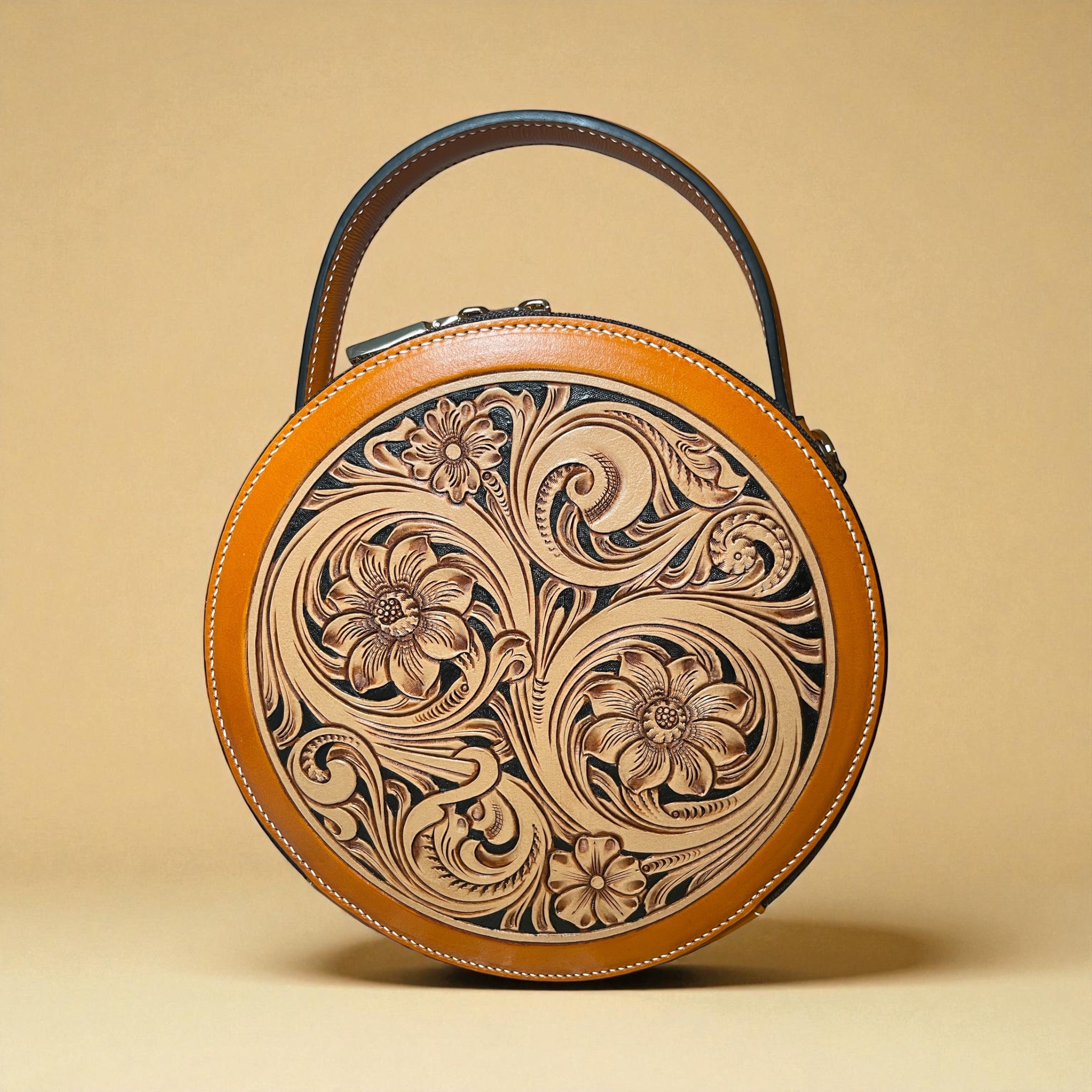 Sac rond Nicky orange en cuir embossé, vue avant – Maison La Reine”