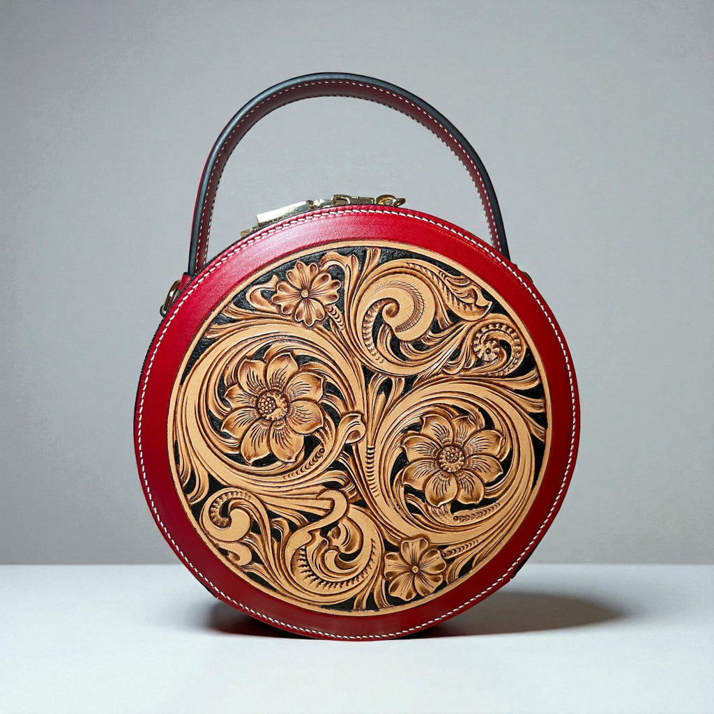 Sac rond Nicky rouge en cuir embossé, vue avant – Maison La Reine”